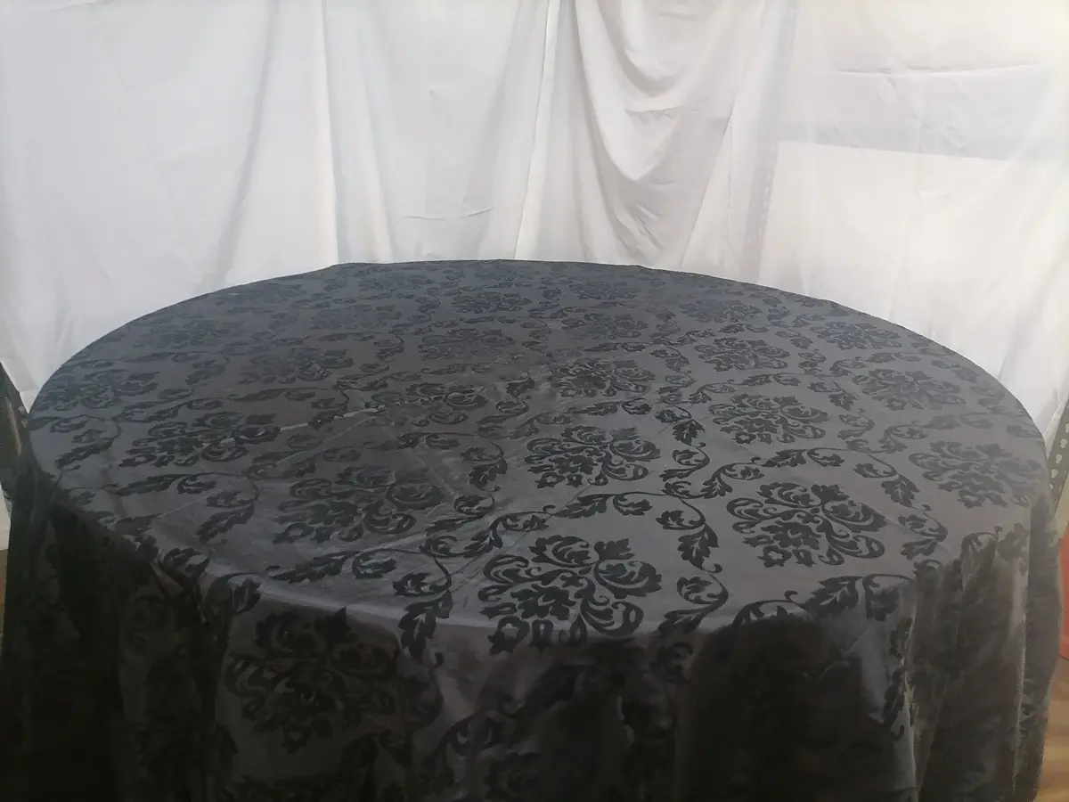 A charcoal damask round cloth