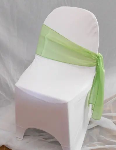 A chair with a green sash